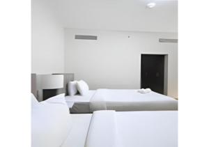 Key View - Welcome Residency客房内的一张或多张床位