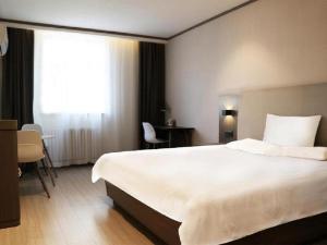 Hanting Hotel Jinan West Market客房内的一张或多张床位