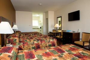 Sands Inn & Suites客房内的一张或多张床位