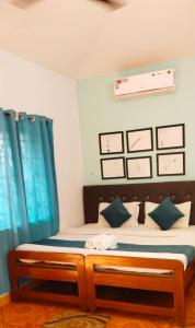 Baga Beach Paradise客房内的一张或多张床位