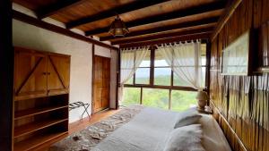 Samai Lodge Holistic Living客房内的一张或多张床位