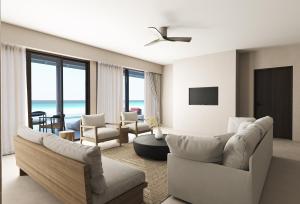 马米基里Villa Haven Maldives Resort的客厅配有白色家具,享有海景。