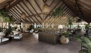 马米基里Villa Haven Maldives Resort的大堂设有桌椅,种植了棕榈树。