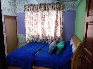 Homestay Bemban Batu Gajah客房内的一张或多张床位