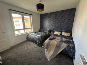 Glasgow Modern style home , separate entrance客房内的一张或多张床位