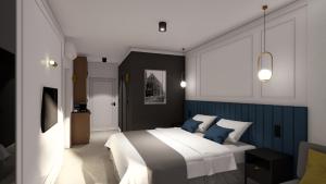 比亚韦斯托克Apartamenty Branicka的一间卧室配有一张蓝色调的大床