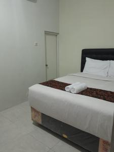 Jogja Amor Hotel客房内的一张或多张床位