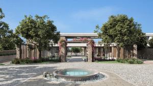 希俄斯PEARL ISLAND CHIOS HOTEL & SPA的庭院中带拱门和喷泉的花园