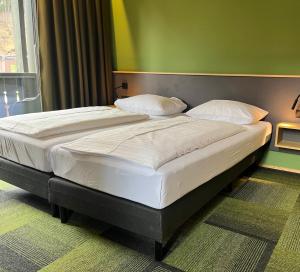 Hotel Simader客房内的一张或多张床位