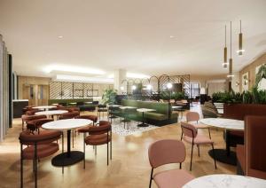 谢菲尔德国敦谢菲尔德酒店的一间带桌椅的餐厅和一个大堂