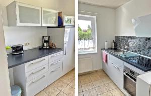 克林克Lovely Home In Klink With Kitchen的厨房配有白色橱柜和台面