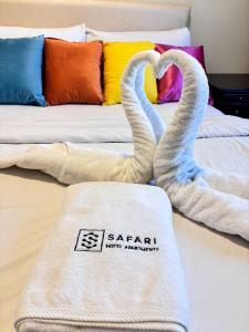 Safari Hotel Apartments客房内的一张或多张床位