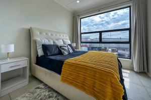 StayEasy Lux Apartment客房内的一张或多张床位