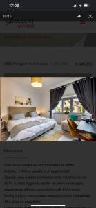 代因泽Appartamento confortevole的卧室的网站,卧室配有床和窗户