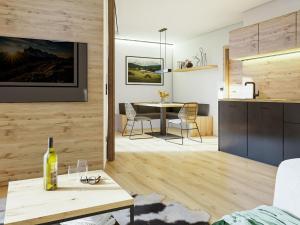 萨尔巴赫Bergzeit Apartments right on the ski slope的一间带桌子的客厅和一间厨房