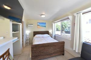 Waimanalo Beach Cottages客房内的一张或多张床位