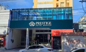 马瑙斯Prestige Manaus Hotel的带有标志的建筑,读了声誉酒店