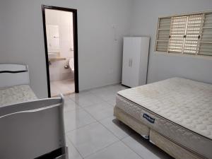Casa de Temporada Isaura客房内的一张或多张床位