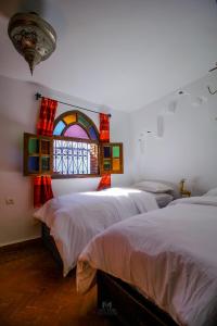 Riad Bab Mahruk客房内的一张或多张床位