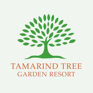 尼甘布Tamarind Tree Garden Resort - Katunayake的中间有绿树的树标志