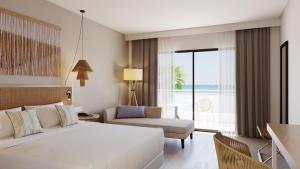阿德耶AluaSoul Costa Adeje的一间卧室配有一张床,另一间享有美景。