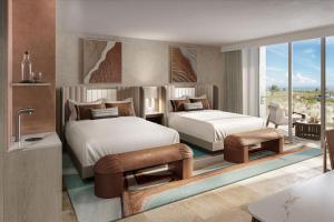 Cockburn HarbourSalterra, a Luxury Collection Resort & Spa, Turks & Caicos 的卧室的 ⁇ 染,设有两张床