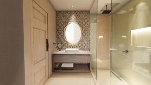 罗萨里托Bellafer Collection Hotel & Resort的一间带水槽和镜子的浴室