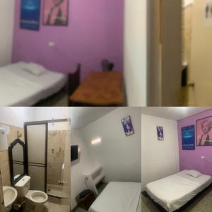 卡利La Clave Hostel & La Clave House的带两张床的房间和一间带浴室的房间