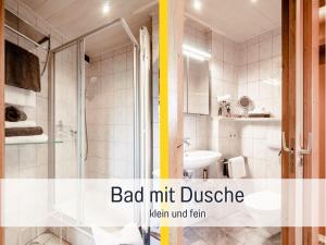 皮丁Ferienhaus Bauer in Piding的带淋浴和盥洗盆的浴室