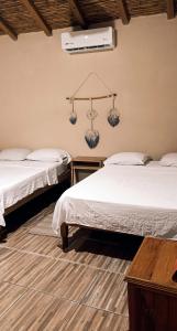 Casa H Rinconcito Mazunte客房内的一张或多张床位