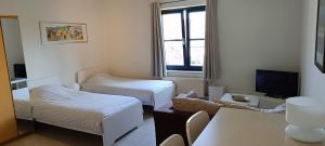 1 2 (Want To) Stay - Furnished business apartments客房内的一张或多张床位