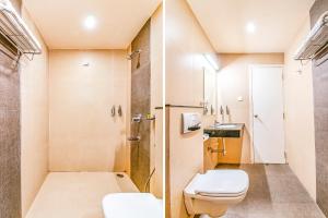哥印拜陀甘地普隆皇家城堡法布酒店 的一间带卫生间和淋浴的小浴室