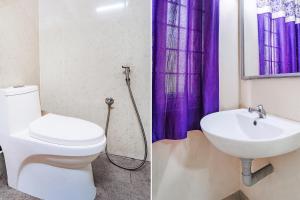 IrugūrFabExpress UV Residency的一间带卫生间和水槽的浴室