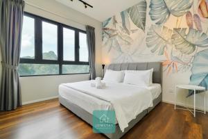 淡文JOMSTAY Sunway Onsen Suites Ipoh - Lost World of Tambun Ipoh Waterpark的卧室配有一张壁画床