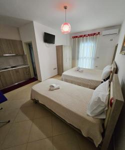 Vacanze Pushime Albania客房内的一张或多张床位