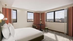 谢菲尔德国敦谢菲尔德酒店的酒店客房设有白色的床和窗户。
