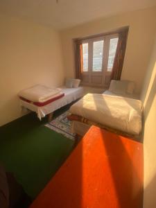 Himalayan Lodge客房内的一张或多张床位