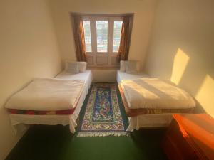 Himalayan Lodge客房内的一张或多张床位