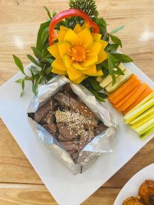 Anh SơnKHÁCH SẠN KIM NHAN的花和蔬菜一束食物
