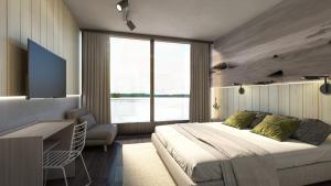 努尔梅斯邦巴布里克所库斯酒店的一间卧室配有一张床、一张书桌和一台电视