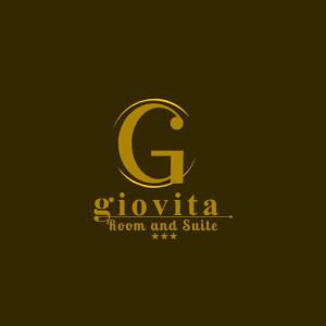 卡尔塔尼塞塔Giovita Room and Suite Centro Sicilia的棕色背景上的金色标志