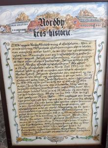 NordbyNordby Kro的一张手写的文件,上面有城镇的照片
