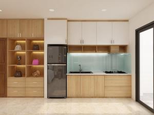 绥和市Dinh’s Aparment的厨房配有木制橱柜和不锈钢冰箱。