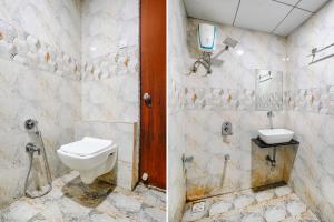 苏拉特FabHotel Gokuldham的一间带卫生间和水槽的浴室