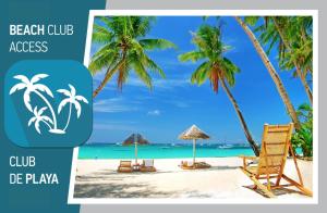 蓬塔卡纳TROPICANA SUITES DELUXE BEACH CLUB and POOL - playa LOS CORALES的海滩俱乐部,设有沙滩椅和棕榈树