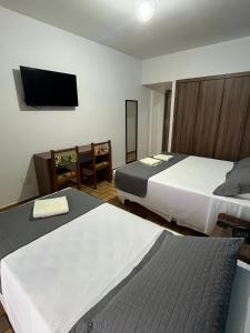 Hotel Quatro Estações客房内的一张或多张床位