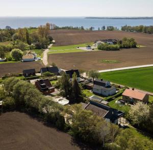 GlumslövLarge Architect designer home 800m from beach的田野农场的空中景观
