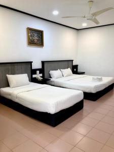 印丹海滩度假酒店客房内的一张或多张床位