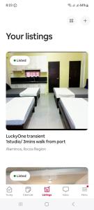 阿拉米诺斯Hundred Islands lucky One Transient 3mins walk fr wharf的一幅有几排床的房间的照片