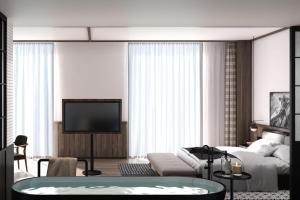 青岛青岛福楼安可傲途格精选酒店的带沙发和电视的客厅